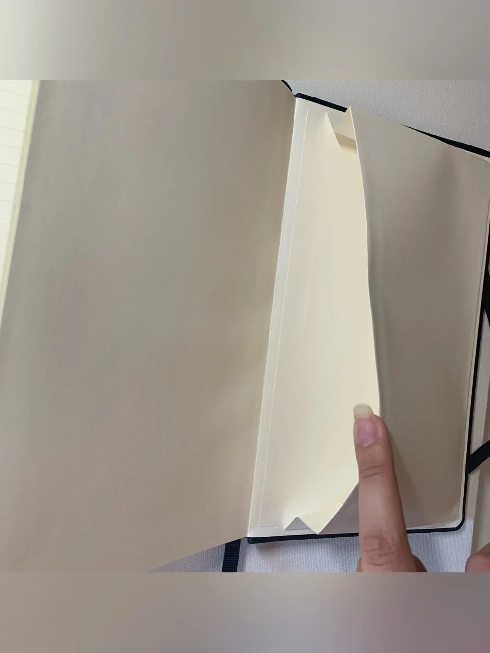 Black leather notebook with elastic band closure